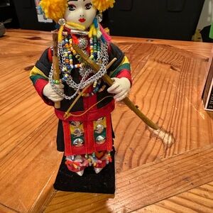 Colorful Beaded Doll Figurine with Yellow Accents